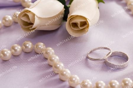 roses and wedding rings