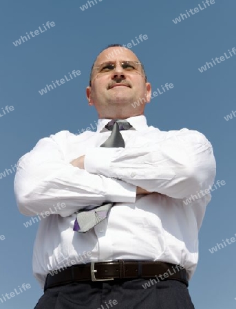 one thoughtful businessman outdoors with sun