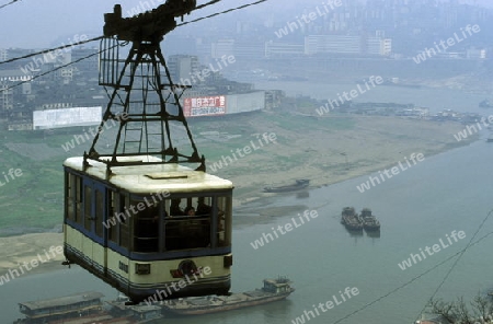 the cable car on the way over the yangzee River in the city of Chongqing in the province of Sichuan in china in east asia. 