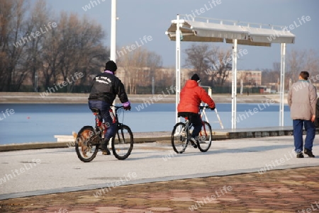 Two mans riding bikes