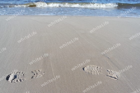 Schuhspuren im Sand